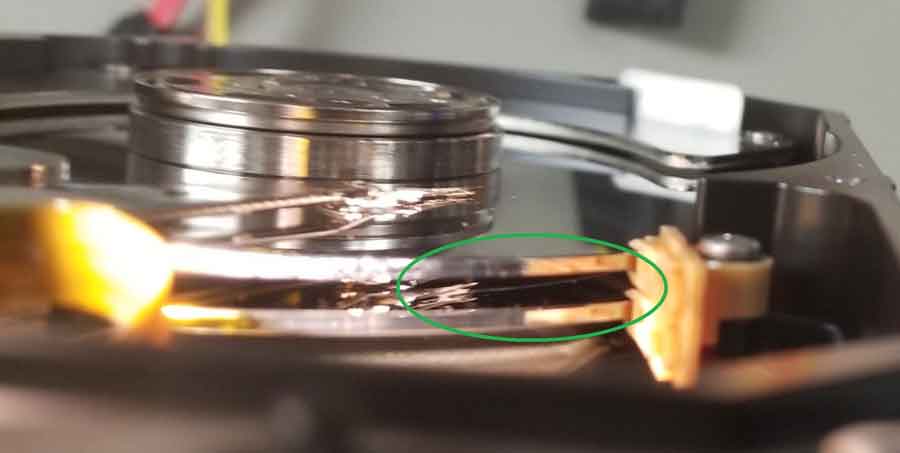 scratched platters on a hard disk drive (HDD) impair digital forensic services