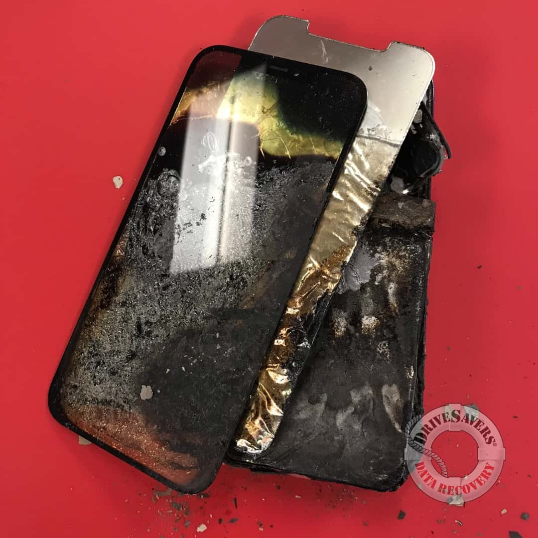 charred remains of an iPhone 12 Pro that was dropped in a bonfire