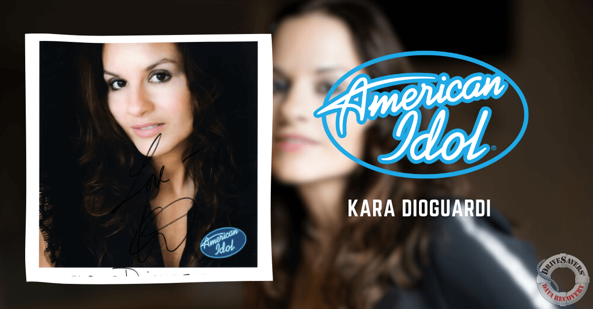 The image likely features Kara DioGuardi, an accomplished songwriter, producer, and former judge on the television show "American Idol." She is known for her contributions to the music industry and has co-written numerous hit songs. In the photo, she is depicted with long wavy hair and a gentle smile.